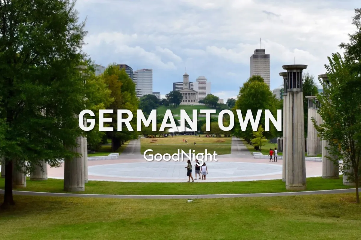 A tranquil park view with walking pathways, open green space, and the downtown skyline in the backdrop. The image suggests opportunities for outdoor adventures, picnics, and access to urban attractions nearby.