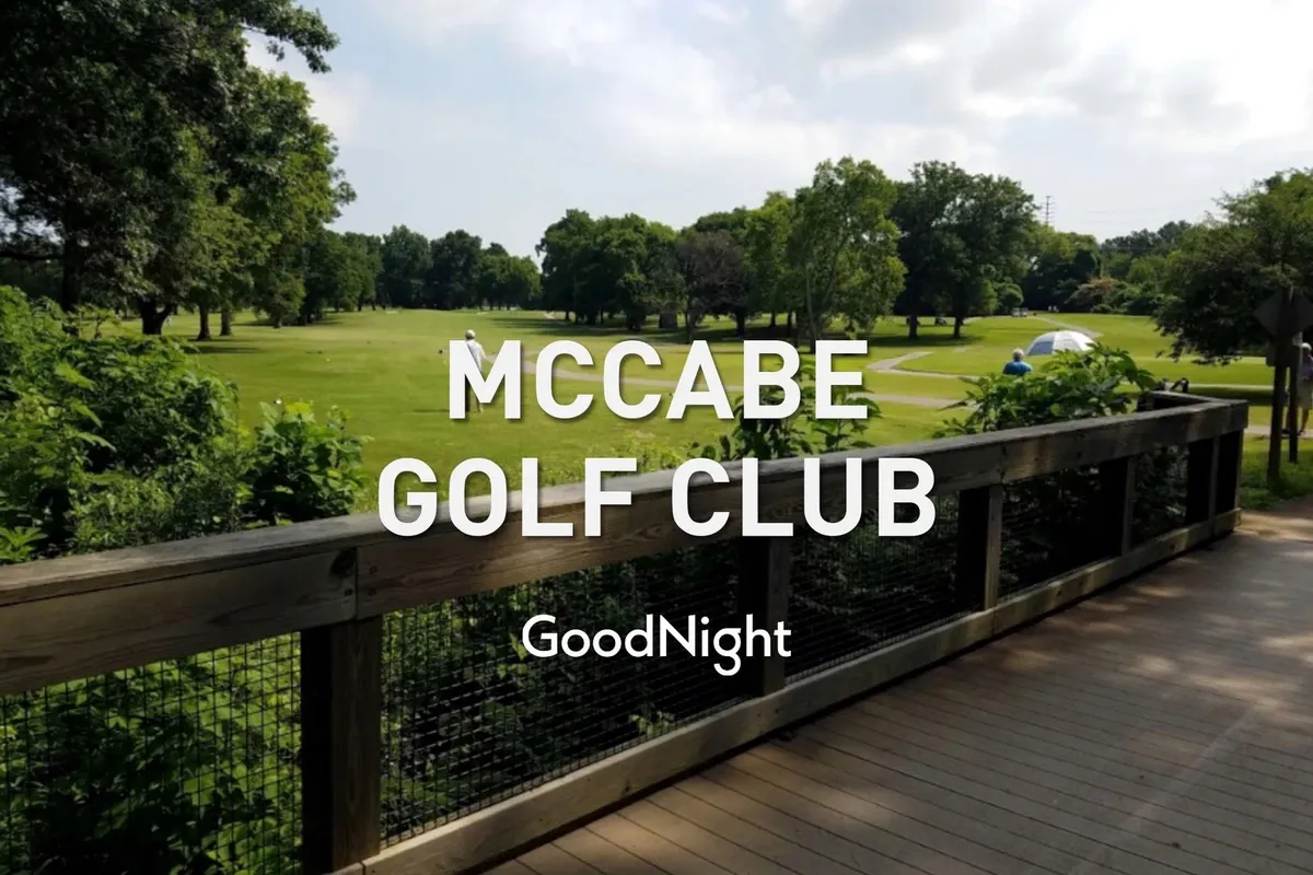 A welcoming wooden deck overlooks a lush, green golf course, surrounded by serene natural landscaping. The deck features comfortable seating, inviting guests to relax and soak in the tranquil outdoor atmosphere. The presence of sunshine and expansive views suggests this is an ideal spot for morning coffee or evening gatherings.